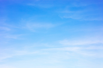 blue sky background and white clouds soft focus, and copy space