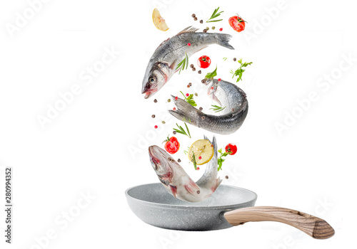 Cuadros en Lienzo Flying food, raw sea bass fish with spices