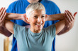 © Microgen - Senior Woman Visiting Physical Therapist