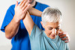 © Microgen - Therapist Checking Senior Woman’s Arm