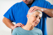 © Microgen - Physical Therapist Stretching Senior Woman’s Neck