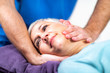 © Microgen - Physical Therapist Stretching Senior Woman’s Neck