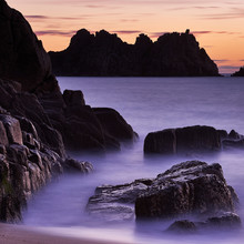 Early Morning On The Beach Looking Out Towards Logan Rock At Porthcurno, Cornwall