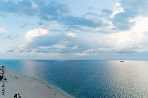 Cloudy Day At Seaside White Clouds Above Smooth Ocean Water