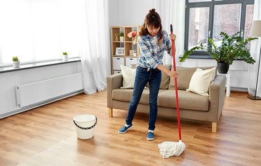 Sticker - people, housework and housekeeping concept - happy asian woman or housewife with mop cleaning floor at home