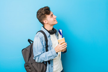 Wall Mural - Teenager caucasian man ready to go to school