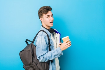 Wall Mural - Teenager caucasian man ready to go to school