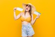 © Asier - Young caucasian woman ready to go to the beach with an air tickets