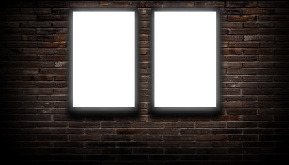 Wall Mural - a white light box or billboard hanging on a black brick wall background in a night building