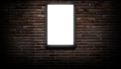 Wall Mural - a white light box or billboard hanging on a black brick wall background in a night building