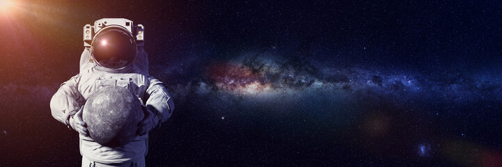 Wall Mural - astronaut holding planet mercury, world of the solar system