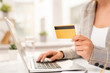 © pressmaster - Hand of businessman entering her personal data while making order in online shop