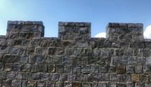 Fortified Castle Wall On Background Blue Sky