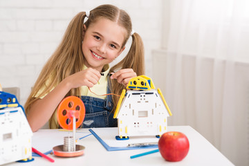 Poster - Stem education. Happy girl constructing robot at lesson