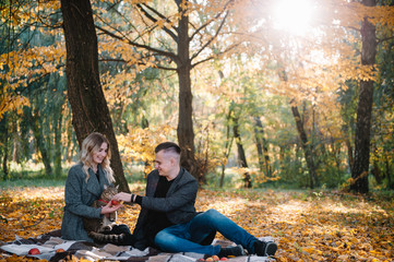 love, relationship, family and people concept - smiling couple having fun in autumn park