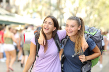 Two Happy Backpackers Laughing Enjoying Vacation