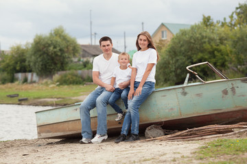 Portrait of Happy Family. Father with two children in countryside outdoors