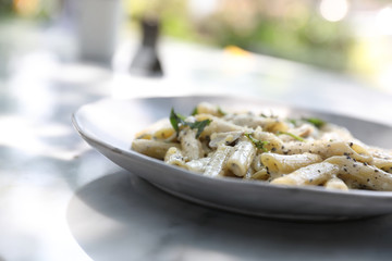 Penne pasta with white sauce and truffle , italian food