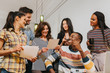 © MyMicrostock/Stocksy - Multi-ethnic businesspeople at the office
