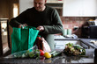 © Jodie Johnson/Stocksy - Unpacking food shopping in the kitchen