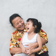 © Chalit Saphaphak/Stocksy - Asian grandmother and her granddaughter