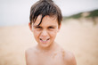 © Boris Jovanovic/Stocksy - Portrait of boy on beach