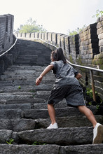 Beautiful Asian Little Girl Climbing The Great Wall