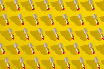 Sticker - Collage red lipstick in gold tube on yellow background