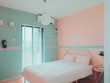 © Pansfun Images/Stocksy - sweet pink contemporary bedroom Interior