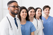 © Prostock-studio - Team of doctors and interns standing in hospital in row
