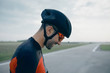 © Branko Starcevic/Stocksy - Side view of smiling cyclist wearing helmet