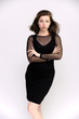 © Вячеслав Чичаев - Horizontal Portrait of a pretty slim beautiful fashionable adult girl with beautiful brunette hair in a black dress. It should be in full growth, talking showing different poses and emotions