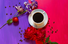 A Cup Of Coffee On A Blue And Red Bright Two-color Background With Coffee Beans And Flowers Of Rose And Eustoma. Bright, Contrasting Coffee Design With Space For Text.