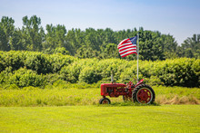 Symbols Of American Farming: Tractor And Flag