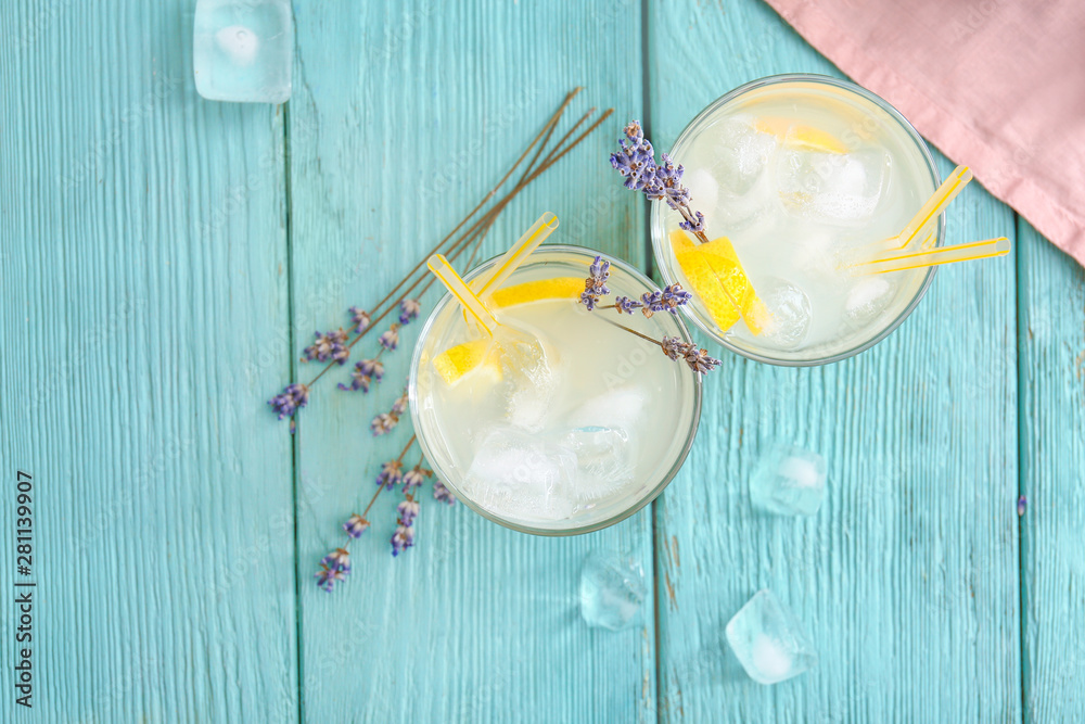 Glasses with lavender lemonade on wooden table