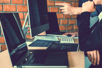 Developing programmer Team Development Website design and coding technologies working in software company office