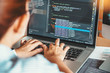 © Nichapa - Developing programmer reading computer codes Development Website design and coding technologies.