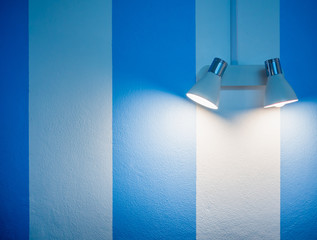 Wall lamp on white and blue wall background