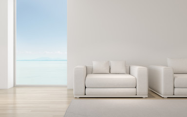 Poster - Perspective of modern luxury living room with white sofa on sea view background,Relaxation idea of family vacation, architecture idea of large window system - 3D rendering.