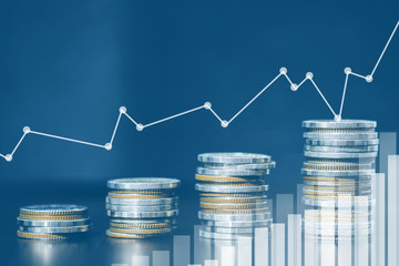 Double exposure of city and rows of coins for money, finance and business concept of teamwork and partnership. ECN Digital economy, best, technology, Industry.