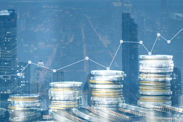 Wall Mural - Double exposure of city and rows of coins for money, finance and business concept of teamwork and partnership. ECN Digital economy, best, technology, Industry.