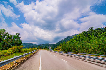 empty road in the middle of tropical forest at Fraser Hill, Malaysia