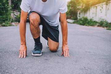 Wall Mural - Runners tied in shoes,Man run on the street be running for exercise,Run sports background and closeup at running shoe