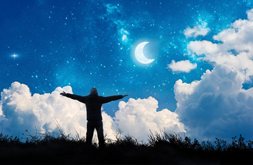 Wall Mural - alone man watching the stars and moon in night sky