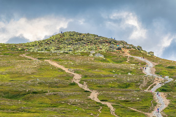 Wall Mural - people who walk up to the top of the mountain