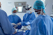 © wavebreak3 - Surgeons performing surgery in operation theater
