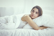 © lenetsnikolai - beautiful young woman basking in bed in the morning. Beautiful
