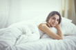 © lenetsnikolai - beautiful young woman basking in bed in the morning. Beautiful