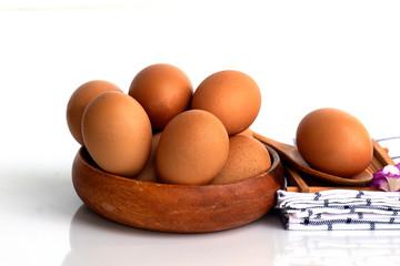 Wall Mural - eggs in basket  isolated on white background