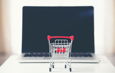 shopping cart with laptop on the desk